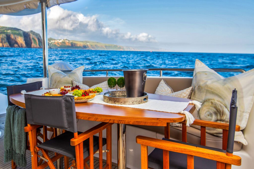 Knysna 500SE cockpit table set for lunch at sea off the Knysna coast